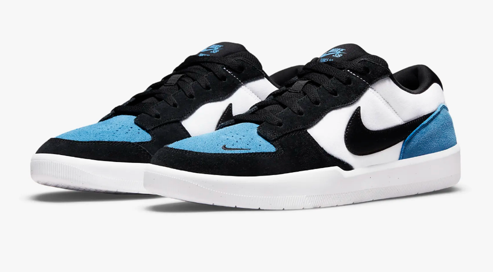 A pair of black and white shoes

Description automatically generated